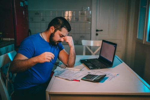 a stressed business owner on his laptop computer