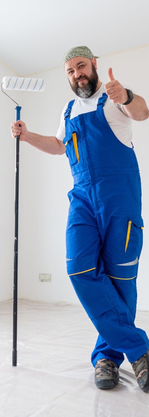 painter standing with stick