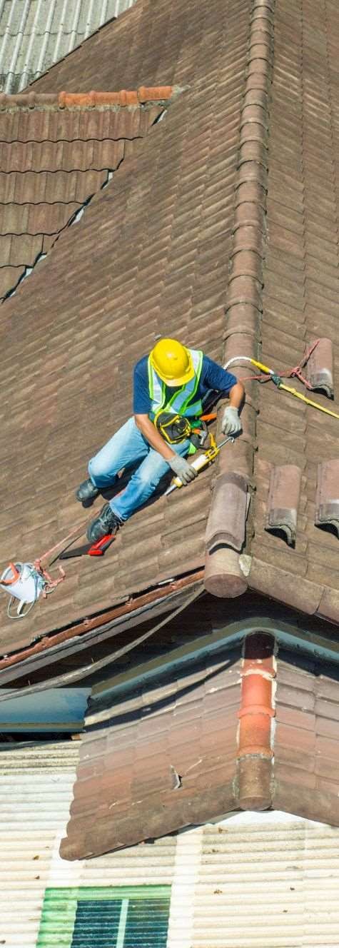 roofer repairing shingle