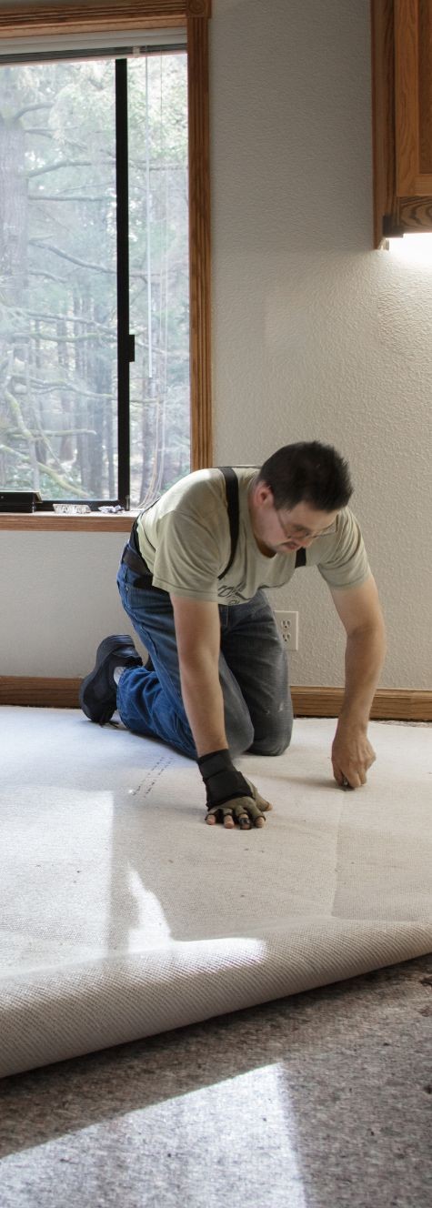 man installing new flooring