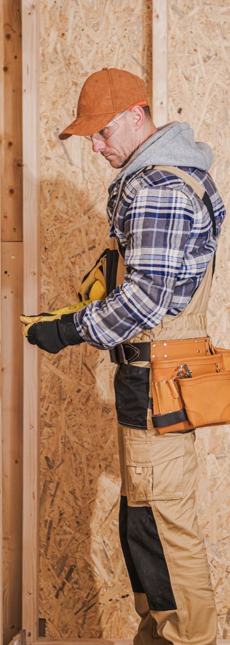 handyman measuring at construction site_Handyman business insurance
