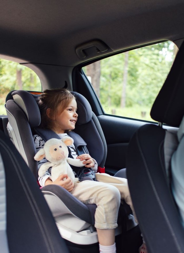 little girl in car seat