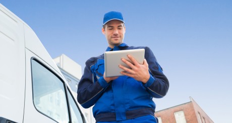 a commercial vehicle operator looking at a clipboard