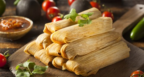 a stack of tamales on a plate