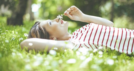 woman laying in flower field