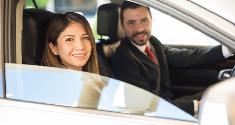 business woman and man driving