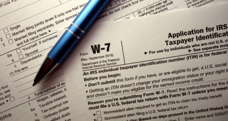 a pen resting on top of an IRS tax form