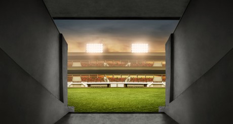 a first person view of someone walking into a soccer stadium