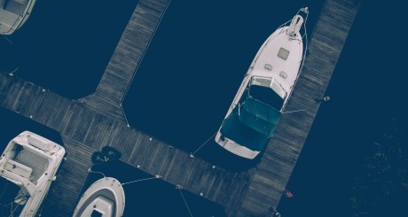 an aerial image of docked boats