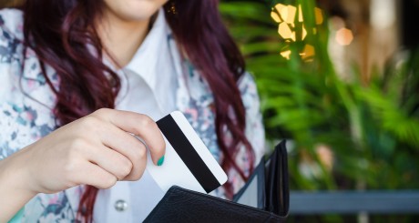 woman swiping credit card