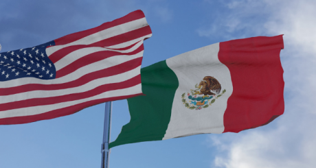 mexican and american flag in the wind