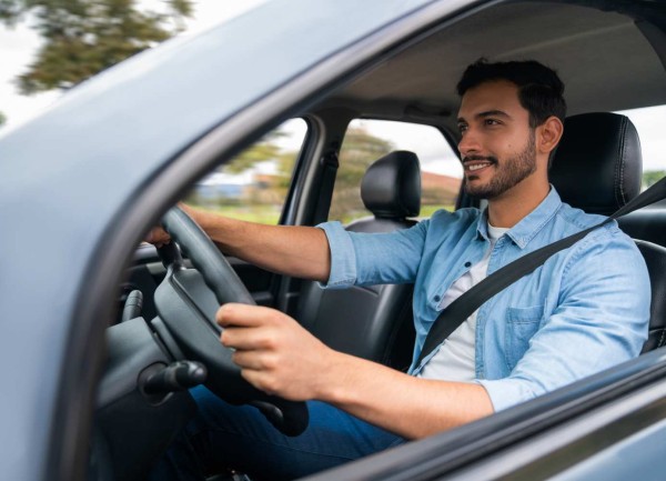 man driving car