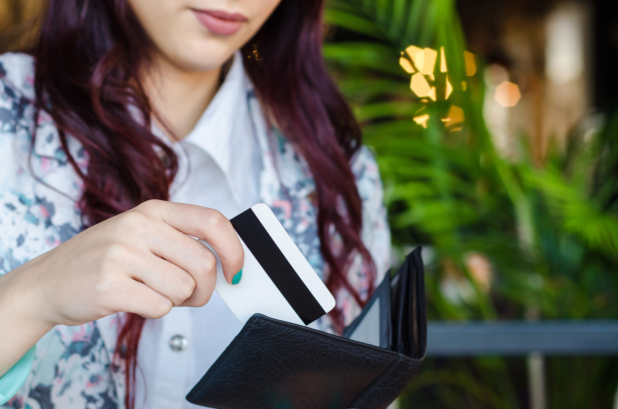 student swiping credit card