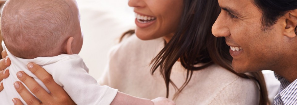 parents holding baby parents holding baby