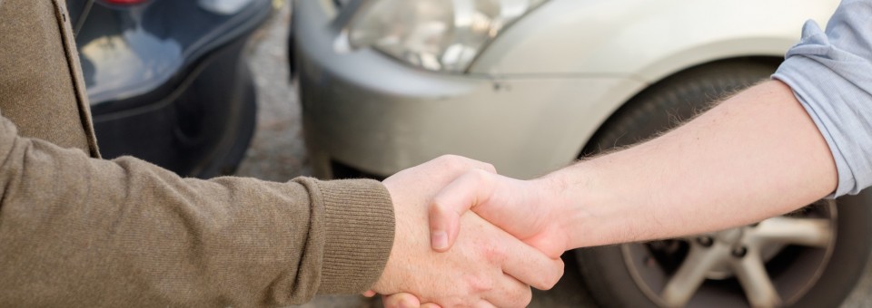shaking hands after accident