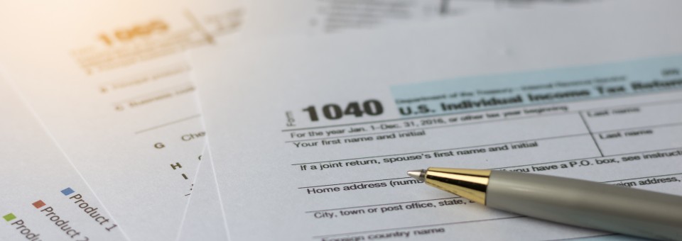 stack of tax forms stack of tax forms