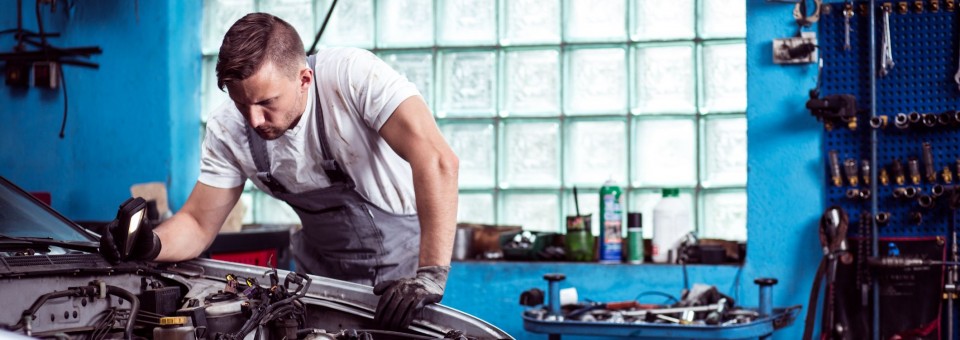 Mechanic Working On Car Mechanic Working On Car