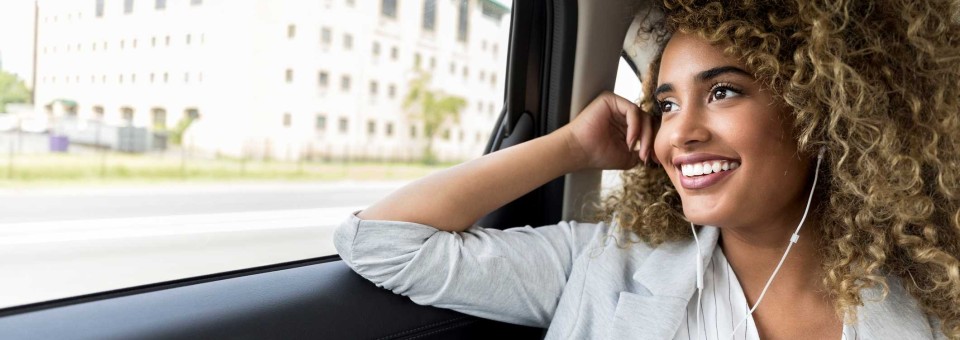 Woman Speaking Phone in Rideshare woman-using-rideshare