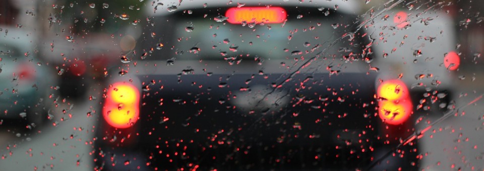 Car with Rain on Windshield